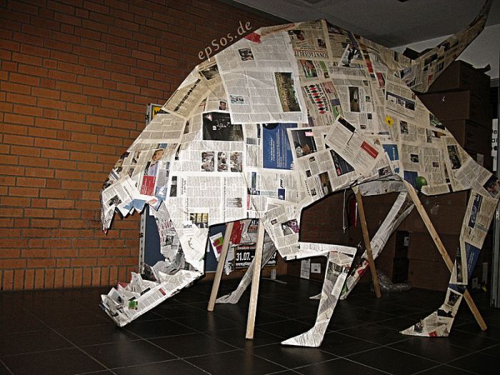 Scary picture prank of a big dog monster in form of an origami dragon. Author epSos.de