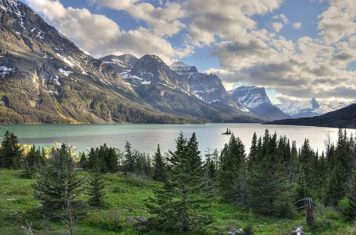 Harry & Stella Wild Goose Island, a narrow, 300-foot-tall spire surviving in the middle of a lake carved by a glacier, is the most photographed spot in all of Glacier National Park. Author Jeremy Bronson