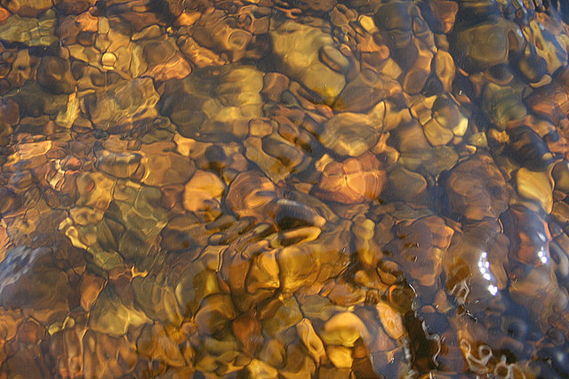 Spey water flowing over amber stones - a natural beauty. The quality of this Spey water must surely have warmed the heart of the celebrated Scottish brewer, Angus Coffey when he set up his first Speyside still. Author Des Colhoun